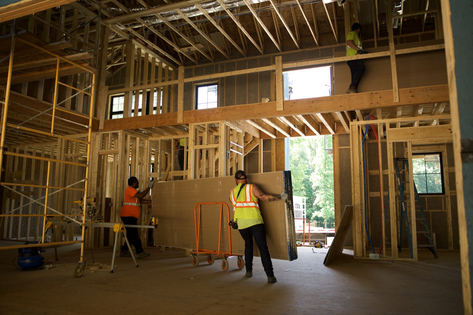 Setting boards in place inside the framed interior